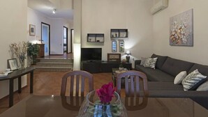 A modern living room with a TV, sofa, and dining area. - mit Pool by Interhome (Medulin/Ližnjan)