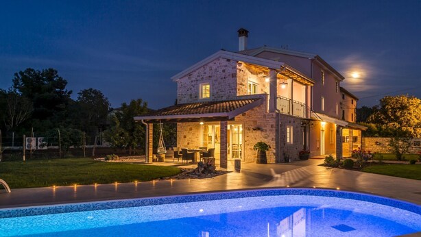 A two-story stone house with a swimming pool in the foreground. - VILLA CON WELLNESS A 1 KM DAL MARE by Interhome (Umag/Juricani)