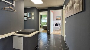 A modern bathroom with a shower, a toilet, and a sink. - Feriendorf E44 by Interhome (Husen)