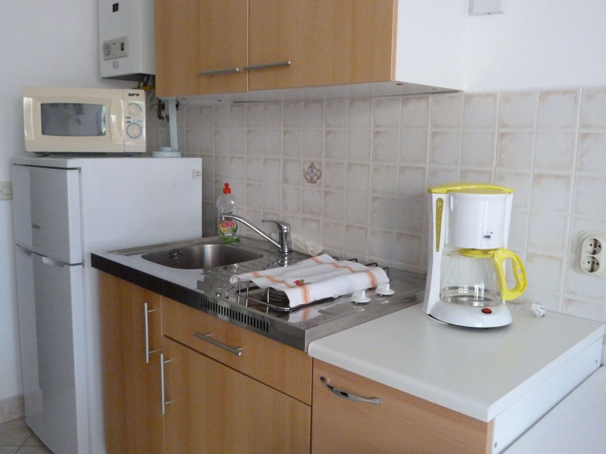 Fridge, microwave, cookware/dishes/utensils