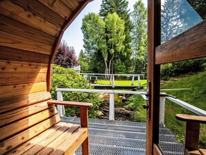 A wooden interior with a view of a bridge and greenery outside. - Landhaus mit gemeinschaftlichem Pool by Interhome (Szklarska Poreba)