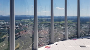 A high-rise building with large windows offering expansive views of a cityscape and surrounding countryside. - Apartment Bär by Interhome (Baiersbronn)
