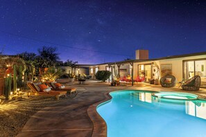 A swimming pool with lounge chairs and a covered patio area. - Pool, pickleball, views, stars, sunsets, perfect (Twentynine Palms)
