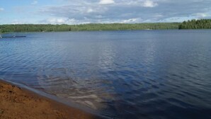 A calm lake with a dock and a forested shoreline. - Typisch schwedisches Ferienhaus mit Garten by Interhome (Vena)