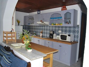 Fridge, microwave, cookware/dishes/utensils