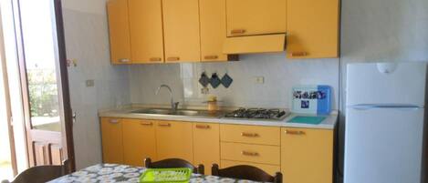 Fridge, oven, cookware/dishes/utensils