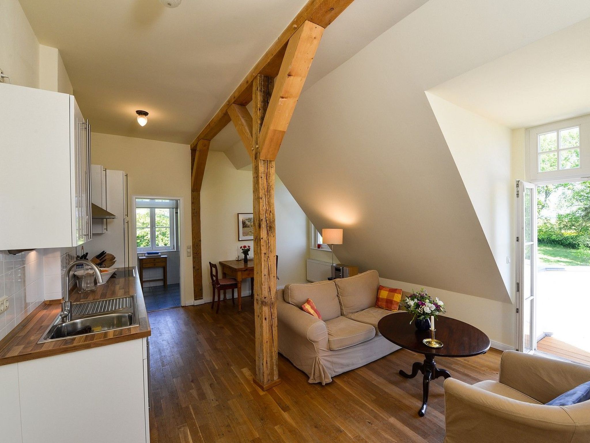 A spacious loft with a kitchen, dining area, and seating area.