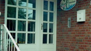 A brick exterior with a white door and a sign reading "Rosalina." - Appartement mit Garten, Grill und Terrasse by Interhome (Kellenhusen)