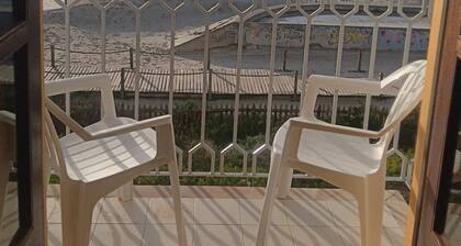 Mit den FĂŒĂen im Sand by Interhome