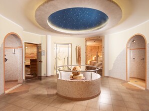 A spa area with a circular hot tub, wooden sauna, and a starry ceiling. - Eck-Haus Nr. 900 by Interhome (Neukirchen am Großvenediger)