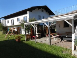 A two-story house with a covered patio area. - Vacation home Dankl by Interhome (Hollersbach im Pinzgau)