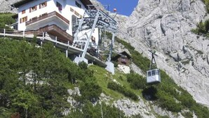 A mountain lodge with a ski lift, surrounded by rocky terrain and greenery. - in Dorfgastein by Interhome (Dorfgastein)