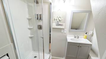 Shower, hair dryer, towels, soap