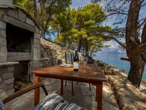 Outdoor dining - Haus in Općina Sućuraj mit Grill und Terrasse by Interhome (Hvar/Sućuraj)