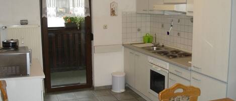 Fridge, microwave, oven, cookware/dishes/utensils