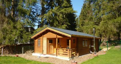 Holz-Blockhaus für vier Personen mit Terrasse by Interhome