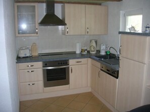 Fridge, oven, dishwasher, cookware/dishes/utensils