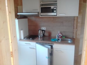 Fridge, microwave, cookware/dishes/utensils - Blockhaus mit eigenem See by Interhome (Pasewalk)