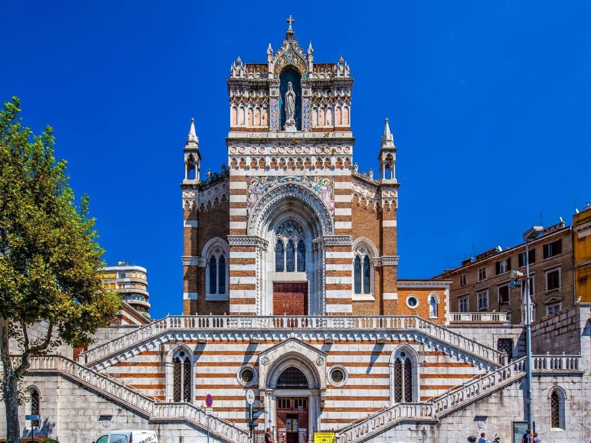 A historic building with a prominent bell tower and intricate facade.