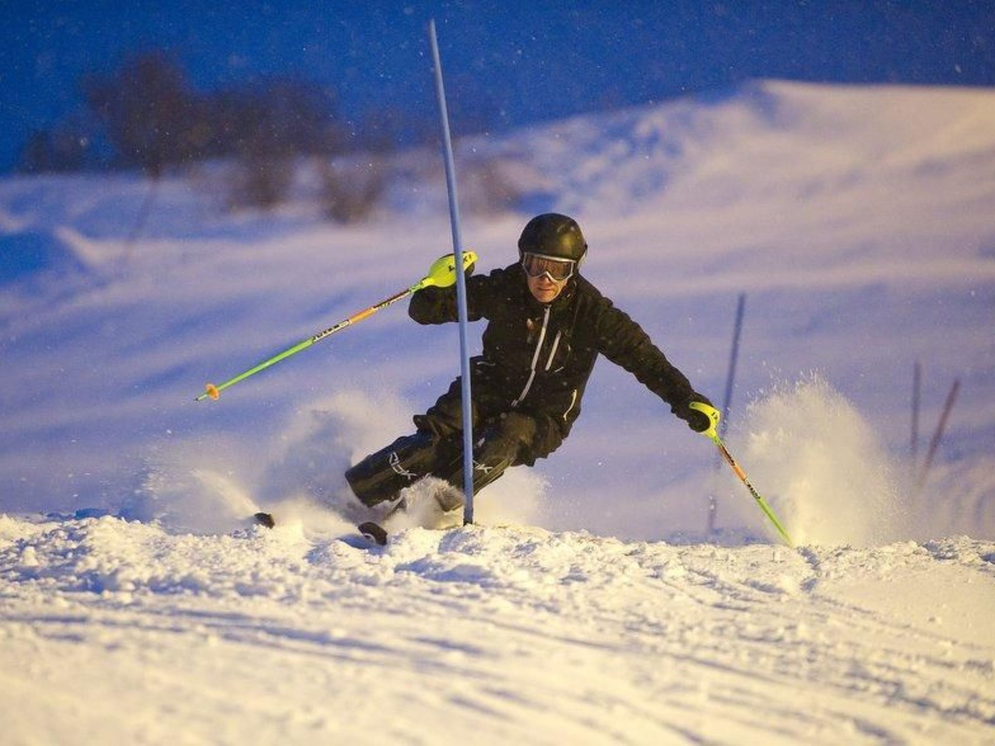 A person skiing down a snowy slope.