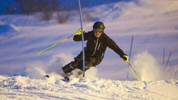 A person skiing down a snowy slope.