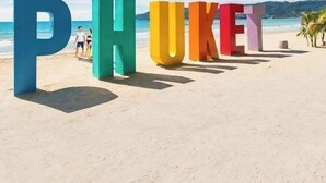 Large colorful letters spelling 'PHUKET' on a beach with a clear sky. - Aqua Maya Phuket (Patong)