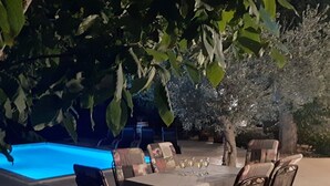 An outdoor dining area with a pool and trees. - AQUA mit Pool by Interhome (Pula/Banjole)