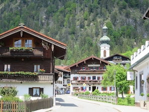 A traditional wooden building with balconies, a bell tower, and a sign indicating it's a hotel. - Haus Heistracher by Interhome (Reit im Winkl)
