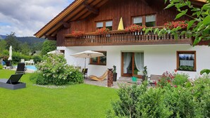 A two-story wooden house with a balcony, a swimming pool, and a well-maintained garden. - Seitz 2 in Bayerisch Eisenstein by Interhome (Bayerisch Eisenstein)
