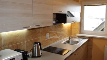 Fridge, microwave, cookware/dishes/utensils