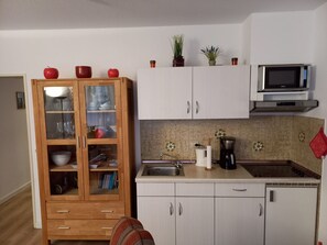 Fridge, microwave, cookware/dishes/utensils