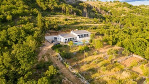 A modern house with a pool, surrounded by lush greenery and hills. - La Finca OliveTree by Interhome (Katuni)