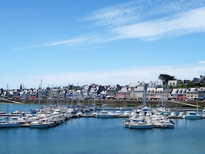 A marina with numerous boats docked, surrounded by a town with colorful buildings. - Maison avec vue mer by Interhome (Camaret sur Mer)
