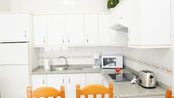 Fridge, microwave, cookware/dishes/utensils