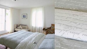 A bedroom with a bed, a bedside table, a lamp, and a window with curtains. - Villa Cresta Bianca by Interhome (Ronco sopra Ascona)