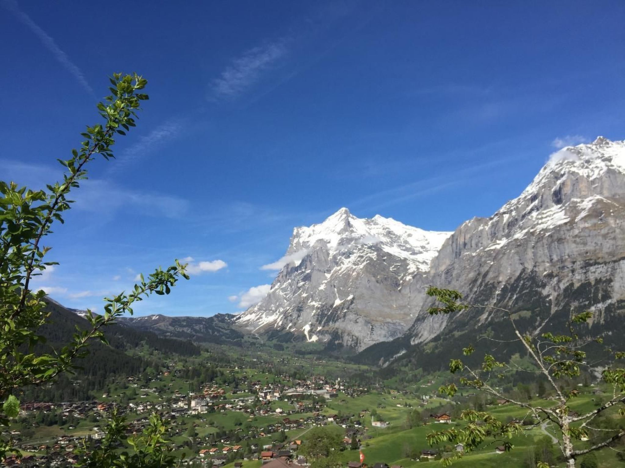A mountain landscape with a village in the valley.