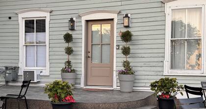Charming historic stay in the heart of Sturgeon Bay! This studio retreat offers a warm and oh-so-cozy four-post bed, walk-in shower, a smart TV, and steps from the waterfront, all the shops and festivals!