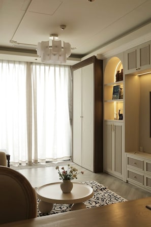 Family Apartment, Connecting Rooms | Living area | 45-inch Smart TV with digital channels, fireplace, Netflix - Worth Living Apartment-Hoan Kiem Lake (Hanoi)