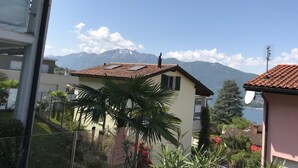A residential area with houses, a mountain, and a lake. - Piazzogna by Interhome (Piazzogna)