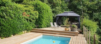 Chalet with swimming pool in a green setting