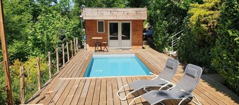 Chalet with swimming pool in a green setting