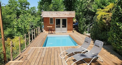 Chalet with swimming pool in a green setting