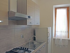 Fridge, oven, cookware/dishes/utensils - Wohnung 'Calamita2' mit Privatparkplatz by Interhome (Capoliveri)