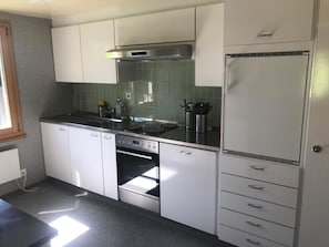 Fridge, oven, cookware/dishes/utensils