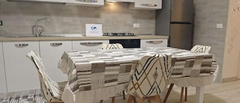 Fridge, oven, cookware/dishes/utensils