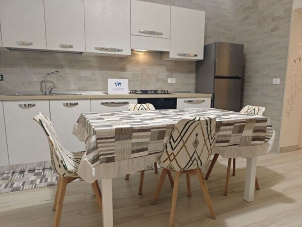 Fridge, oven, cookware/dishes/utensils