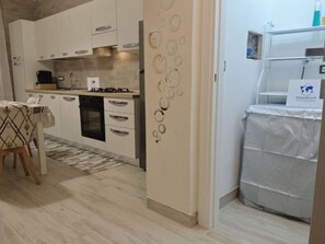 Fridge, oven, cookware/dishes/utensils