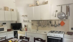 Fridge, microwave, cookware/dishes/utensils