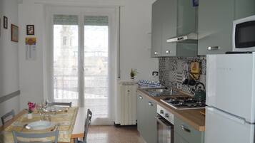 Fridge, oven, cookware/dishes/utensils