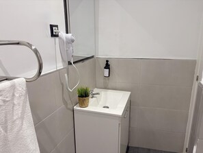 Hair dryer, towels, soap, toilet paper